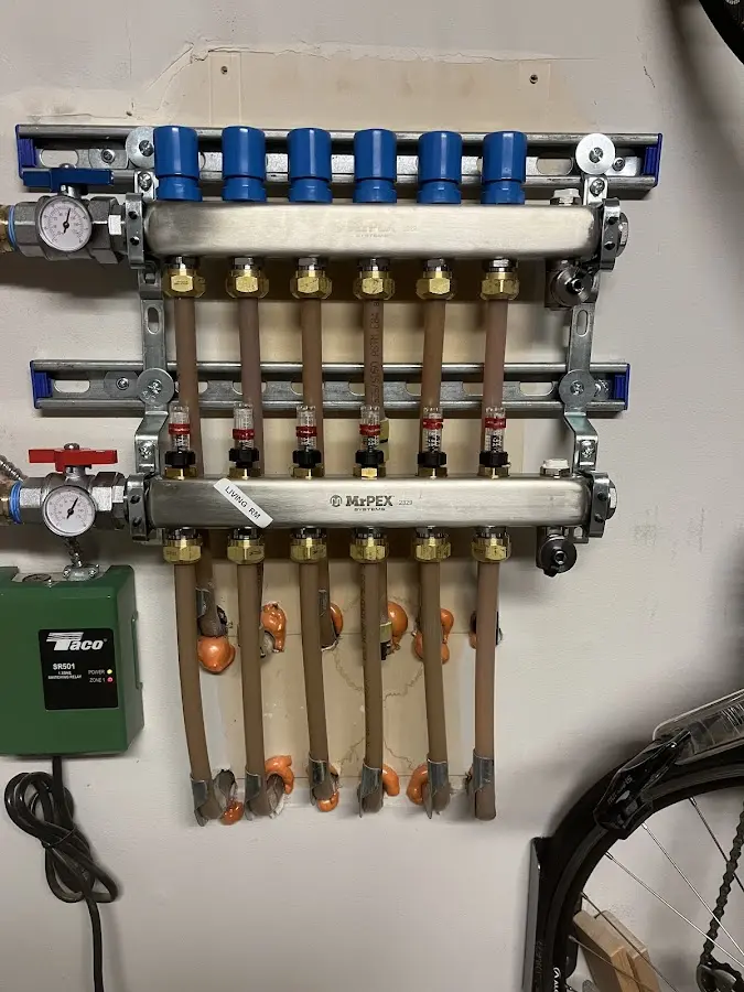 Plumber performing Water Heater Repair at a residential property in Highland Falls